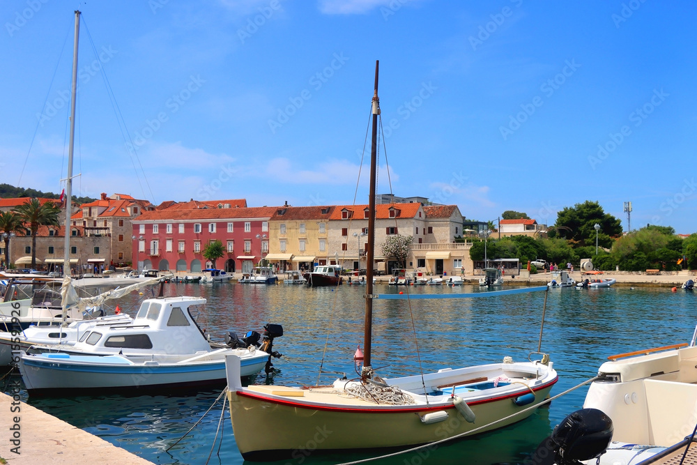 Small picturesque boats in the port of Supetar, on island Brac, Croatia. Sunny summer day.