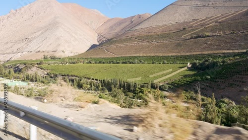 on the move view from a vehicle to the landscape and vineyards in the Elqui Valley photo