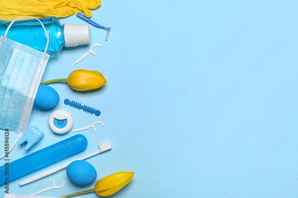 Set for oral hygiene with Easter eggs and tulips on blue background