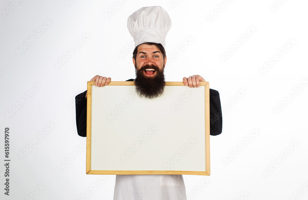 Smiling male chef with empty whiteboard. Cook showing billboard with copy space for text. Chef menu. Master chef, baker or cook with blank poster for advertising healthy menu. Cooking, culinary, diet. Smiling male chef with empty whiteboard. Cook showing billboard with copy space for text. Chef menu. Master chef, baker or cook with blank poster for advertising healthy menu. Cooking, culinary, diet.