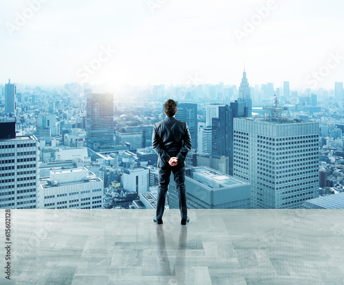 Businessman looks far for future and new opportunities