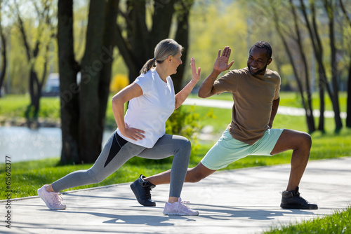 Mature couple having a workout together in the park