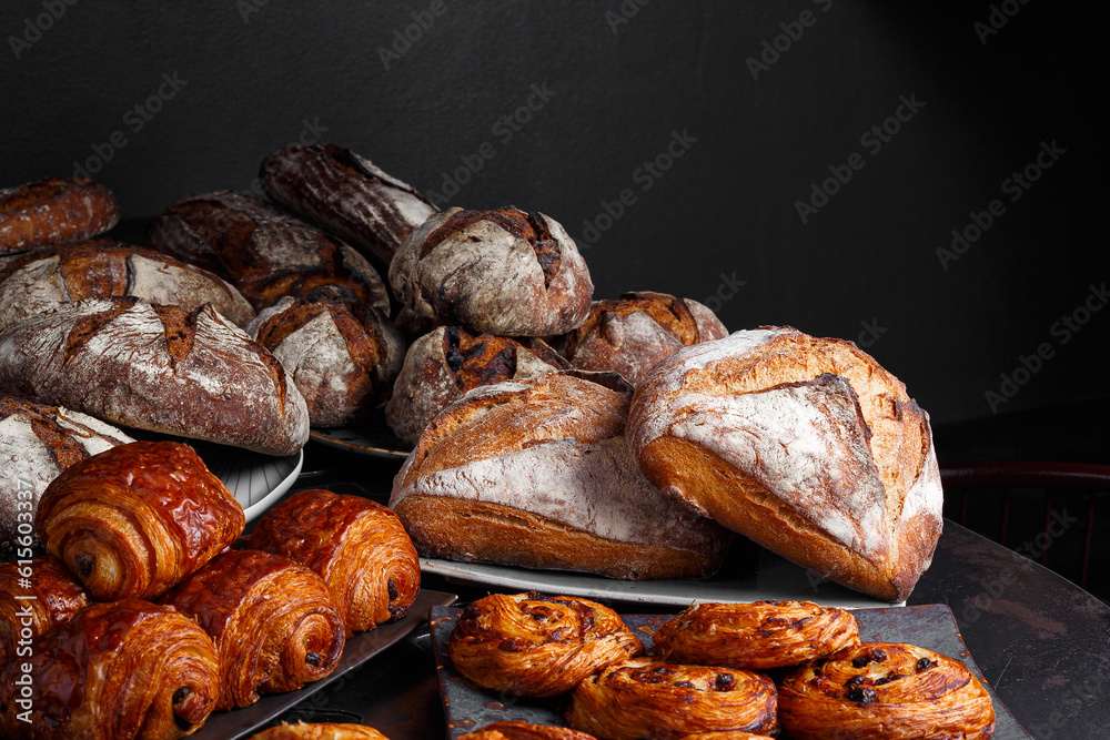 Fresh healthy bread food group in studio on table with dark background