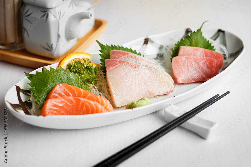fresh sashimi (Raw fish) set in a plate, Japanese popular tradition food