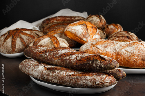 Fresh healthy bread food group in studio on table with dark background