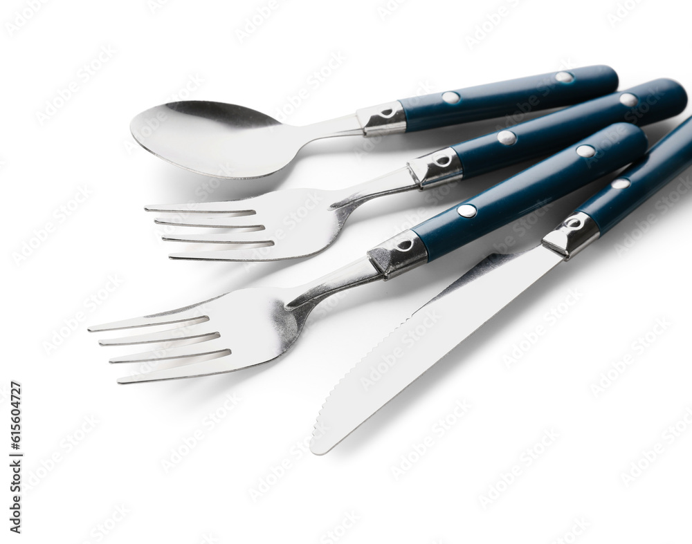 Stainless steel cutlery with blue handles on white background Stainless steel cutlery with blue handles on white background