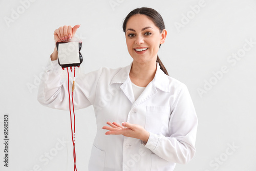 Female doctor with blood pa...