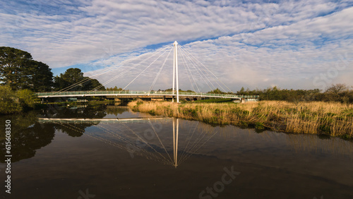 suspension bridge river reflection 
