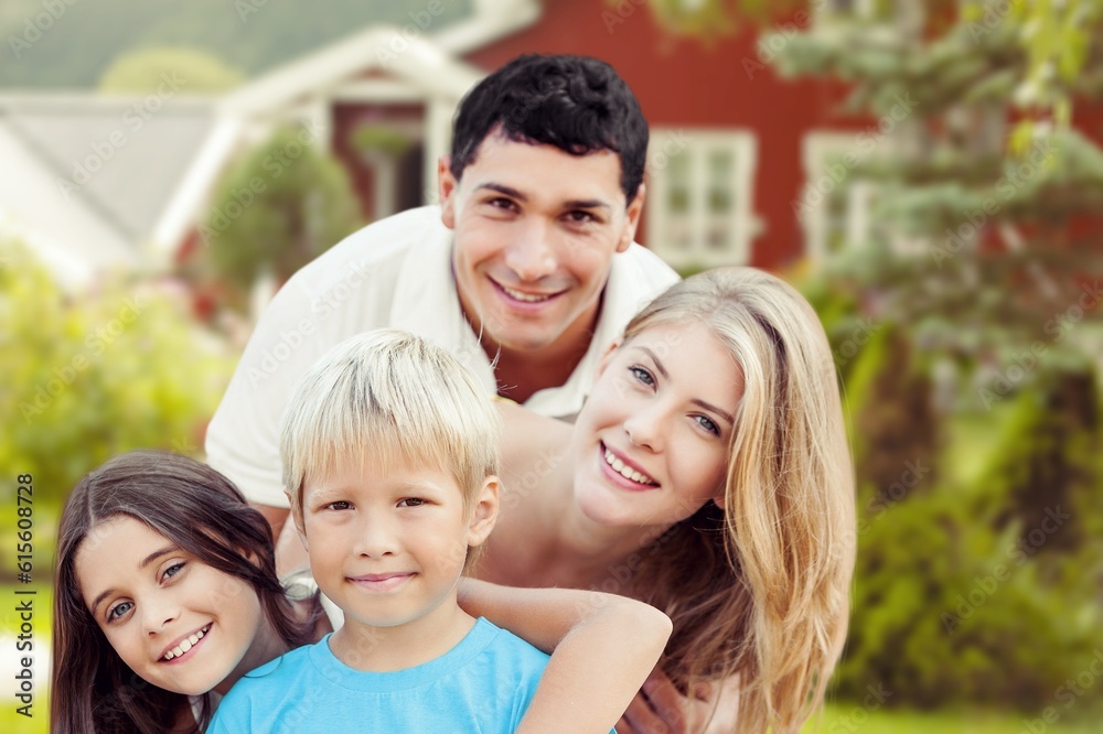 Happy young family near new house have fun Happy young family near new house have fun