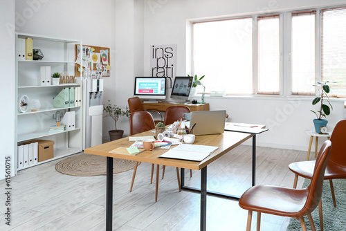 Interior of office with graphic designer's workplaces © Pixel-Shot