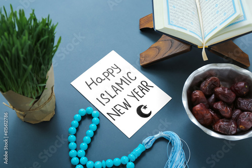 Card with text HAPPY ISLAMIC NEW YEAR, Koran, tasbih, grass and dried dates on color background photo