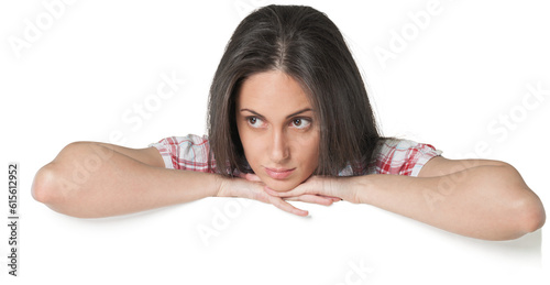 Young woman resting her arms on top of a blank sign