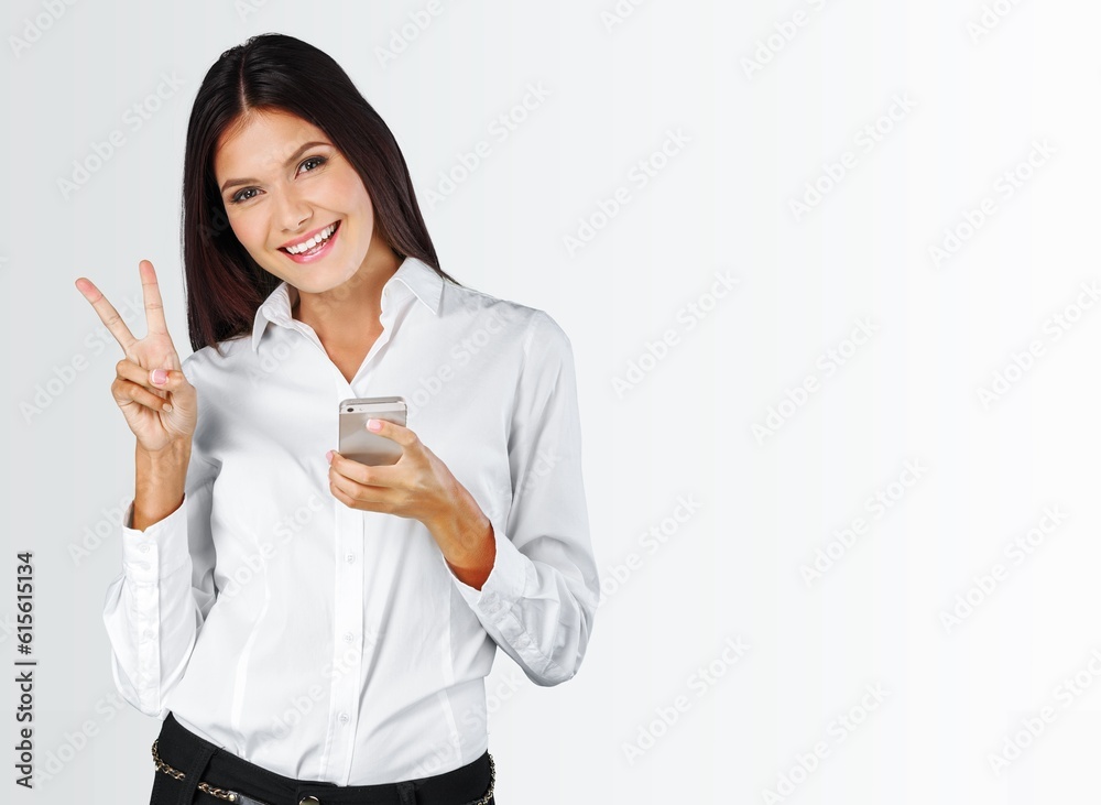 Confident positive young woman with smartphone Confident positive young woman with smartphone
