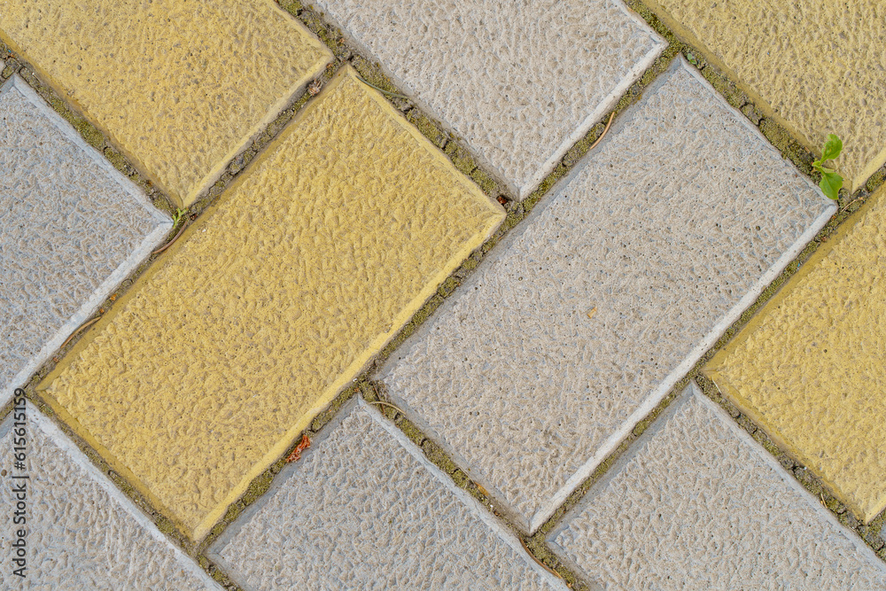 Fototapeta premium Rough textured paving slab surface, top view. Background or backdrop. Design blank