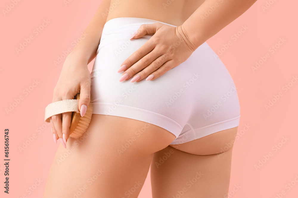custom made wallpaper toronto digitalYoung woman massaging her leg with anti-cellulite brush on pink background, back view