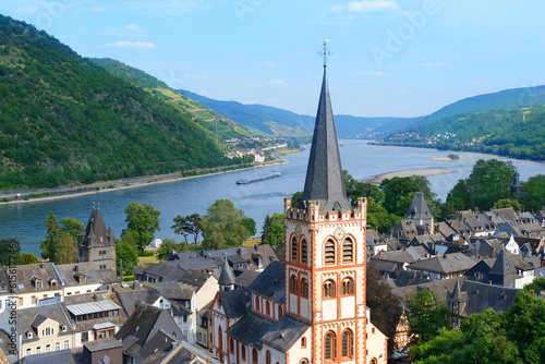 Grape Escape Rhine Valley, medieval German Bacharach city, Old Post Compound With Postenturm, wide waters of Rhine River, slate roofs of old half-timbered houses, wine tourism in Rhineland-Palatinate