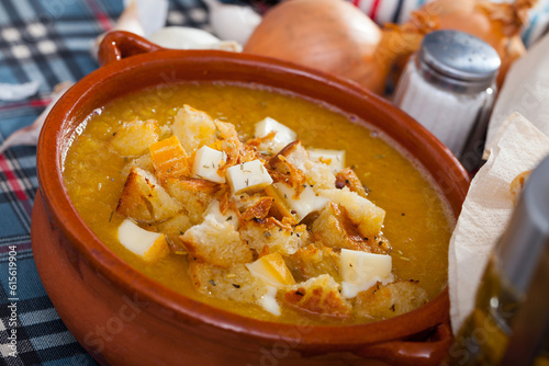 Vegetable soup with croutons and cheese