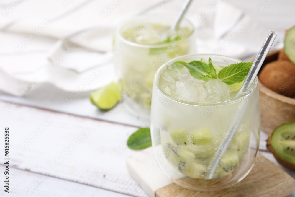 Refreshing drink with kiwi and mint on white table, closeup. Space for text Refreshing drink with kiwi and mint on white table, closeup. Space for text