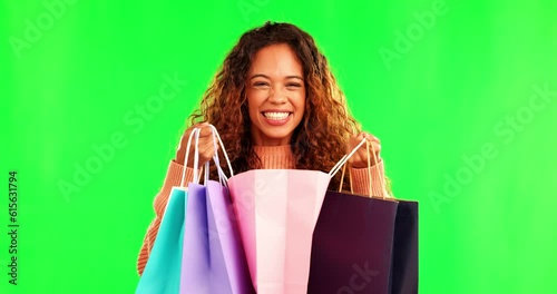 Happiness, excited woman on green screen with shopping bag and surprise for gift, reward or bonus gift with smile. Happy, screaming and surprised girl with paper bags, prize and deal at boutique sale