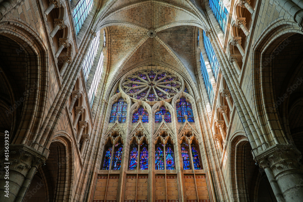 Fototapeta premium Stained glass of the rose window of the basilica-cathedral of Soissons, dedicated to Saint Gervais and Saint Protais in the French Aisne department in Picardy - Medieval cathedral in France