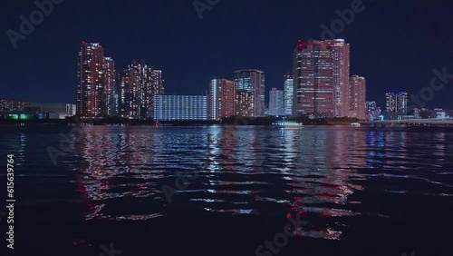 Night light Tokyo, Tsukuda, Toyosu skyscrapers and bridge the Sumida River Yakatabune, pleasure boat photo