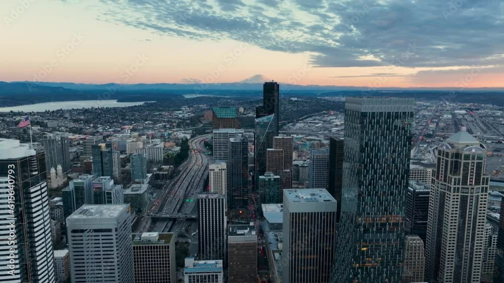 Drone shot of downtown skyscrapers in the evening glow in Seattle, Washington. Drone shot of downtown skyscrapers in the evening glow in Seattle, Washington.