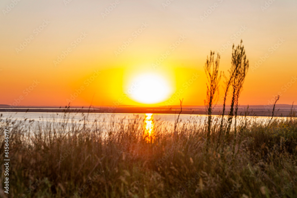 Gorgeous orange sunrise on the lake. Beautiful nature. Gorgeous orange sunrise on the lake. Beautiful nature.