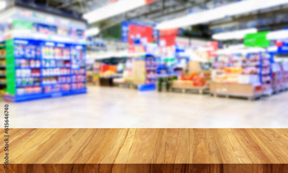 Wooden counter with blurred supermarket background. Table in the foreground for displaying products.