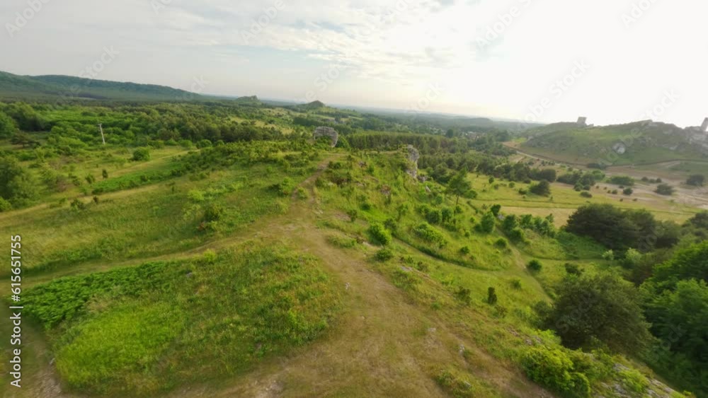 FPV drone aerial view of ruins of Gothic Olsztyn Castle ruins surrounded by greenrey, Poland FPV drone aerial view of ruins of Gothic Olsztyn Castle ruins surrounded by greenrey, Poland
