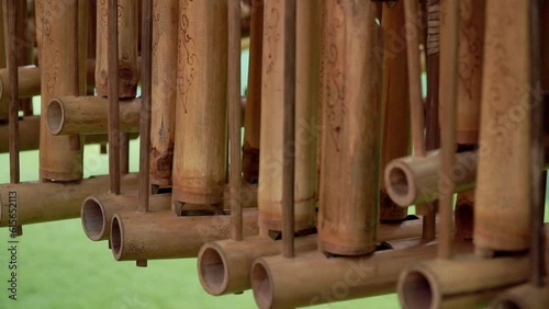 Row of angklung traditional musical instrument. Indonesian traditional music instrument photo