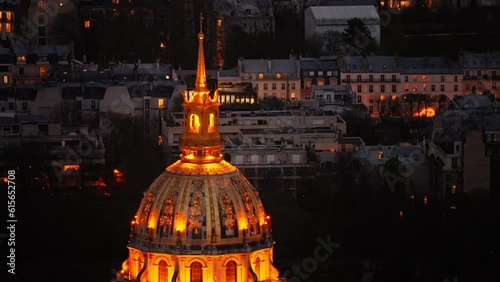 Dome des Invalides or tomb of Napoleon illuminated at night. Zoomed view photo