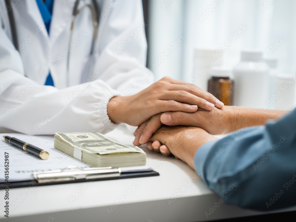 © Phushutter - Mature chinese woman in consultation with a doctor with abdominal pain. depression.
