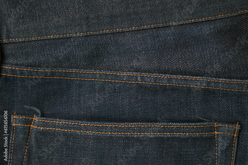 blue jeans pocket stitch texture closeup dark indigo