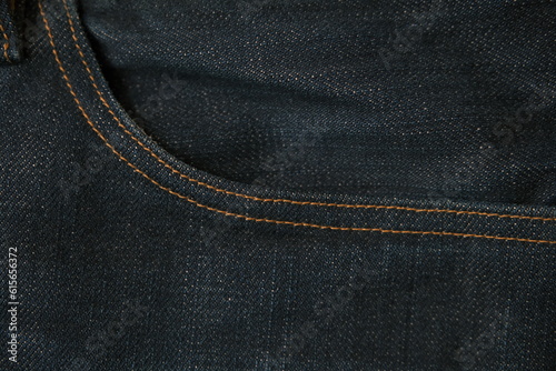 blue jeans front pocket stitch closeup dark indigo