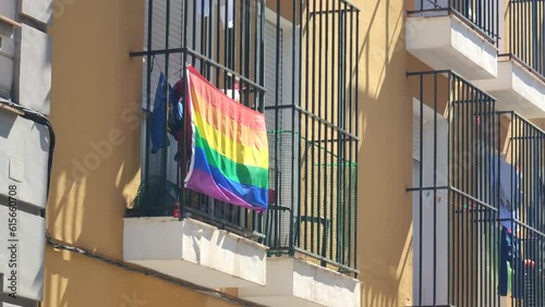 LGBTG+ Rainbow LGBT Pride Flag on Building Window photo