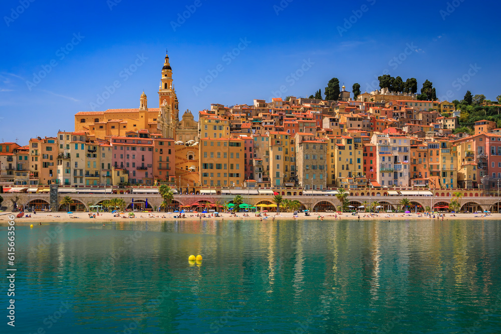 View of the colorful old town facades above the Mediterranean Sea in Menton on the French Riviera, South of France on a sunny day
