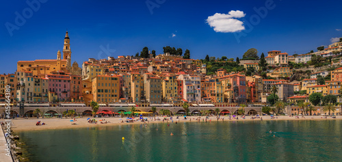 View of the colorful old town facades above the Mediterranean Sea in Menton on the French Riviera, South of France on a sunny day photo