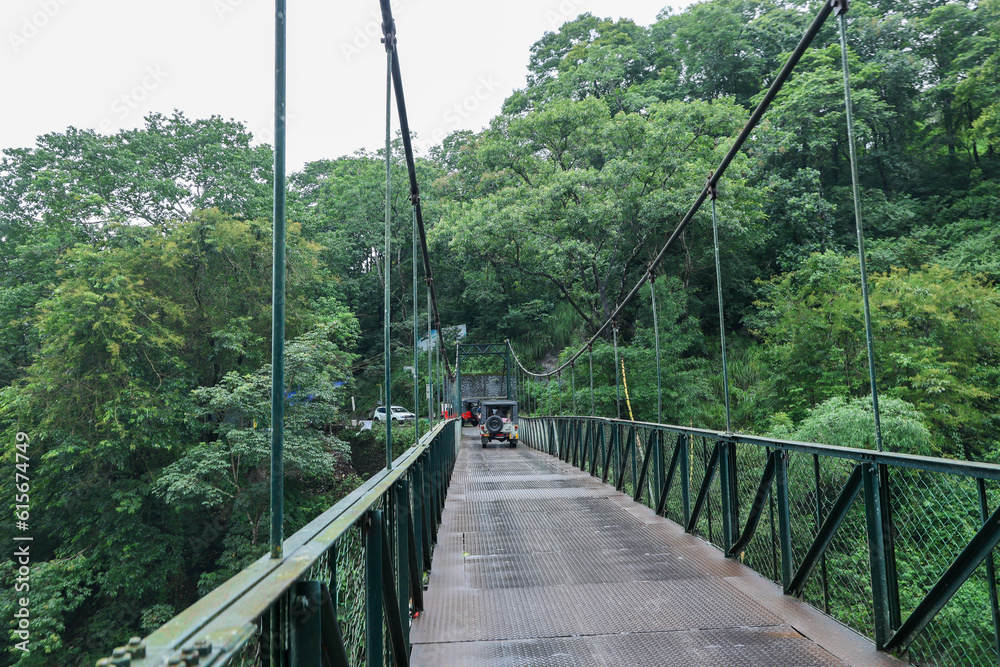 Obraz premium An old iron bridge over old seasonal river of outskirt of Munnar Idukki Kerala India. 