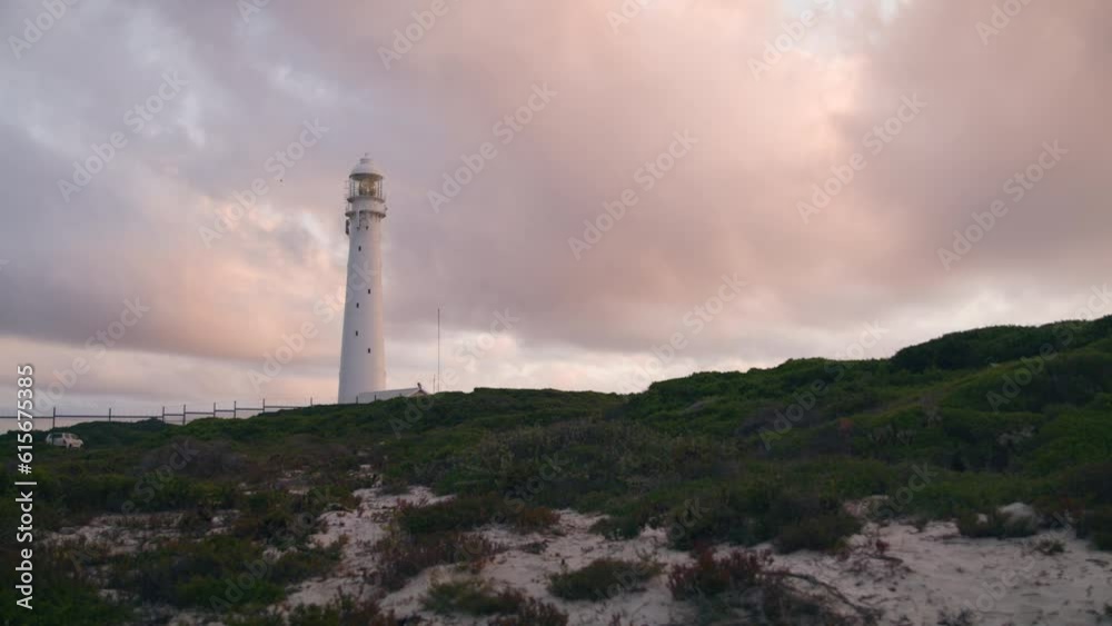 Slangkop Lighthouse in Kommetjie near Cape Town South Africa at sunset at beach Slangkop Lighthouse in Kommetjie near Cape Town South Africa at sunset at beach