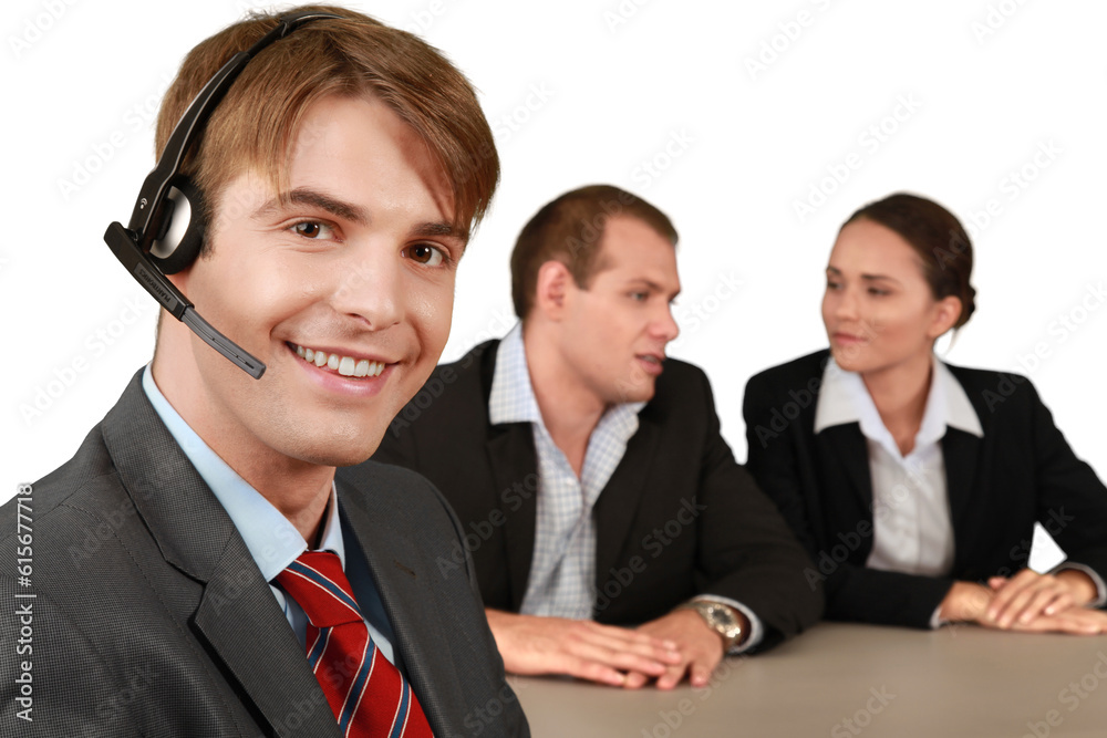 Smiling Businessman with Headset and Talking Collaborators in Background - Isolated Smiling Businessman with Headset and Talking Collaborators in Background - Isolated