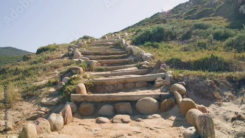 Stairs out of wooden logs and stoney leading uphill at cape point national park