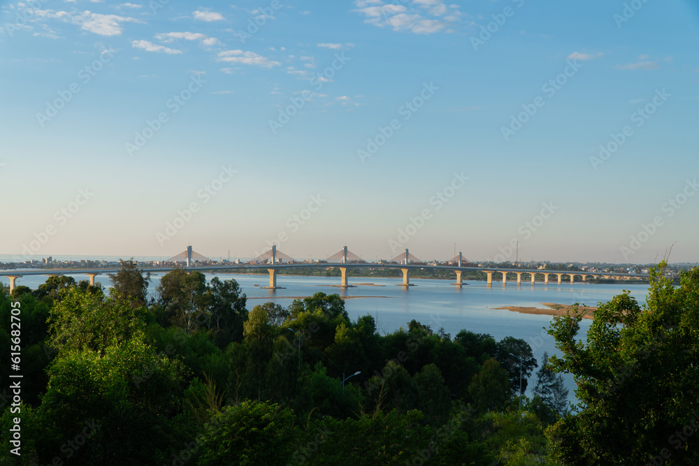 Landscape of Co Luy Bridge, Quang Ngai, Vietnam with Tra Khuc River and clear blue sky in the morning.