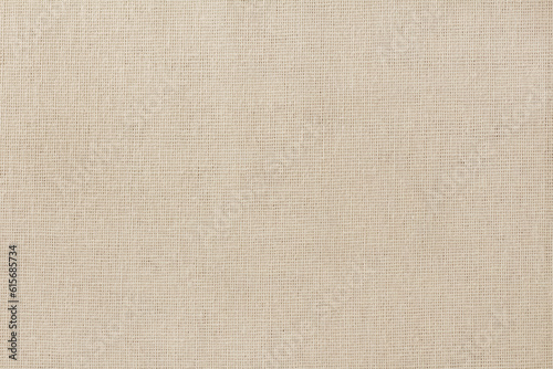 Brown cotton fabric cloth texture for background, natural textile pattern.