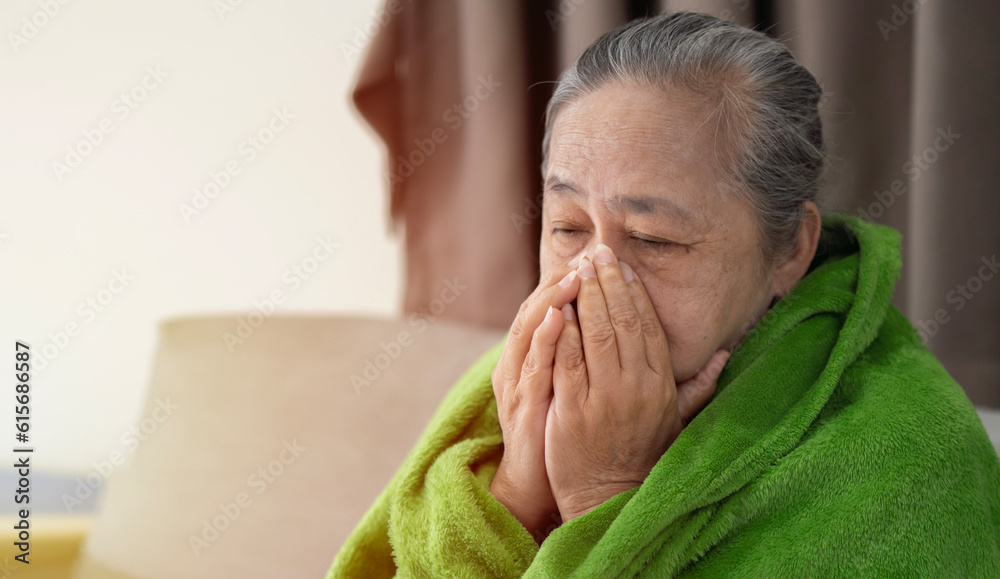Asian senior ill female have a cough and sore throat. Causes of cough include common cold Asian senior ill female have a cough and sore throat. Causes of cough include common cold