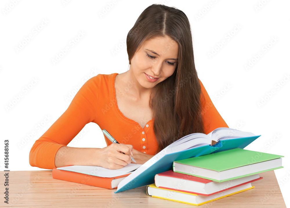 Beautiful young female student doing homework Beautiful young female student doing homework