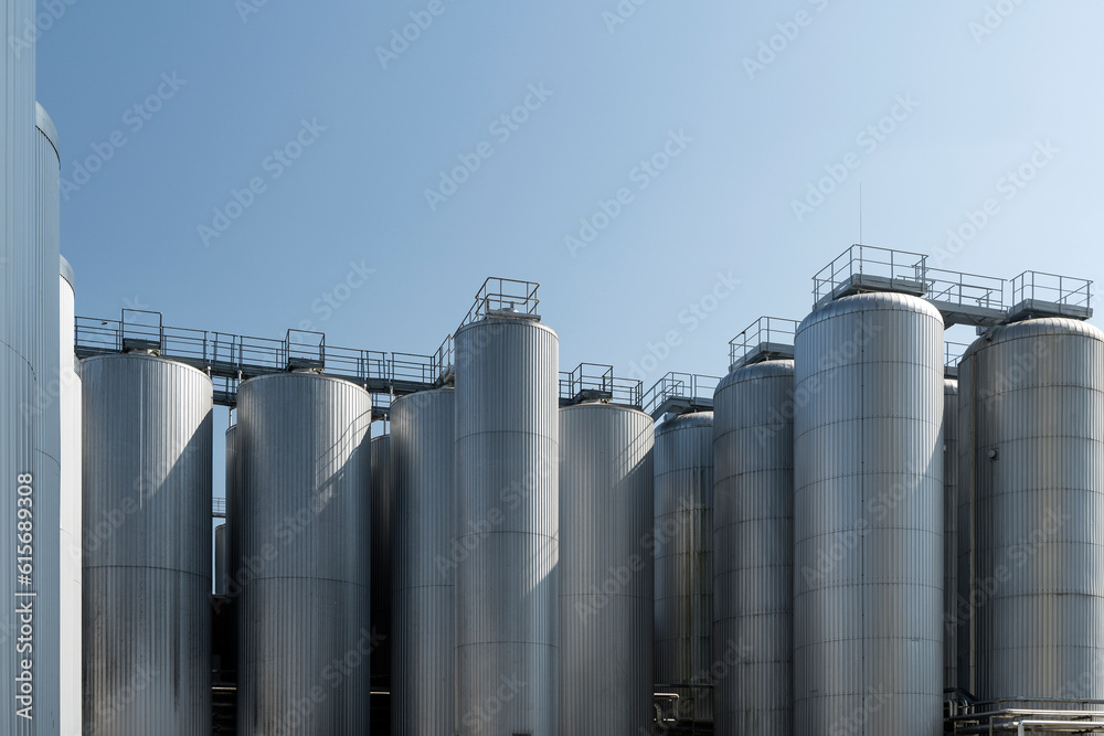 Agricultural silos for storage of grain harvest at an agricultural production farm