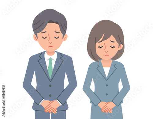 お詫びをするビジネスパーソン男女