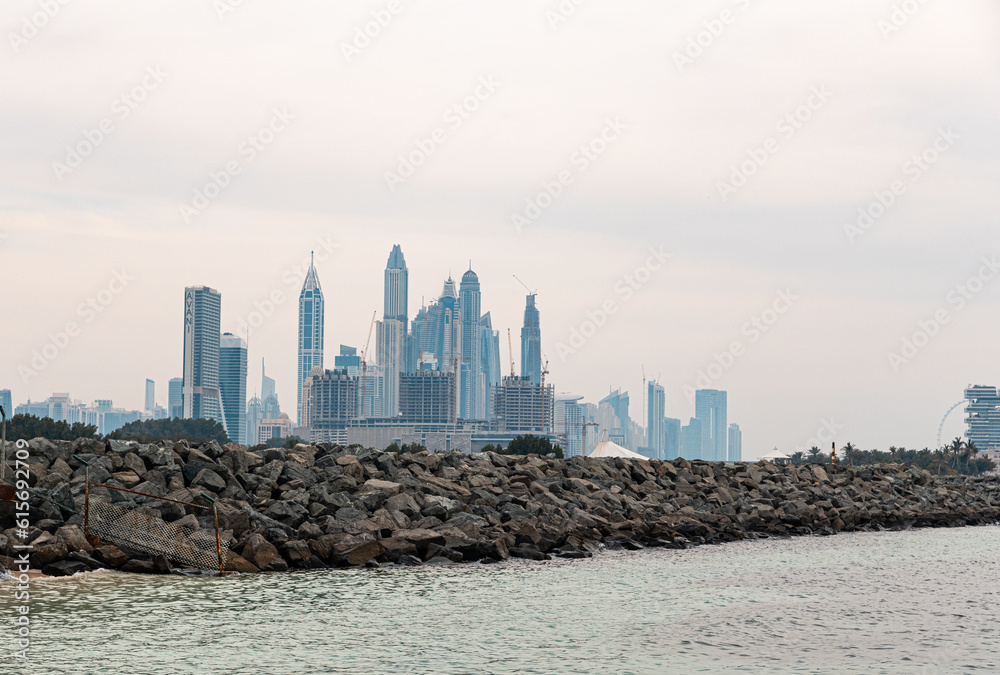 United Arab Emirates, Dubai, April 2023: View to the Dubai Marina with the skycrappers. Cloudy sky.