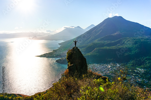 Climber on a giant rock and beautiful landscape, Indian Nose Viewpoint, Sololá Guatemala photo