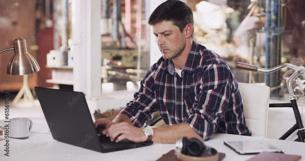 Laptop, factory and business man in workshop office for typing email, website and browse internet. Warehouse manager, foundry and male person working on computer for logistics and manufacturing